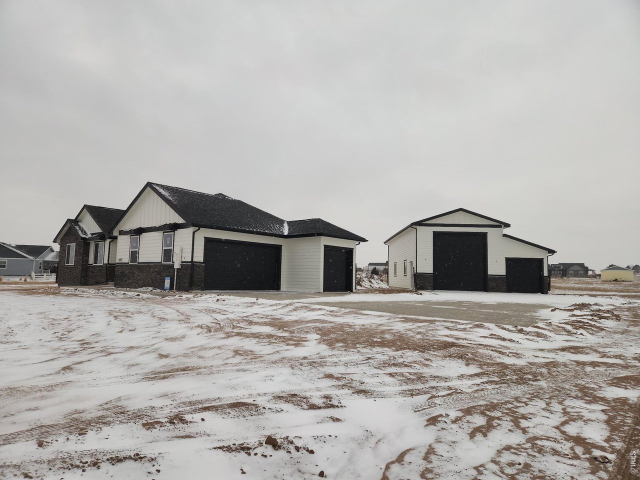 16505 Fairbanks Road North Platteville, CO 80651 - Photo 3 of 13 a big house with a yard and wooden fence