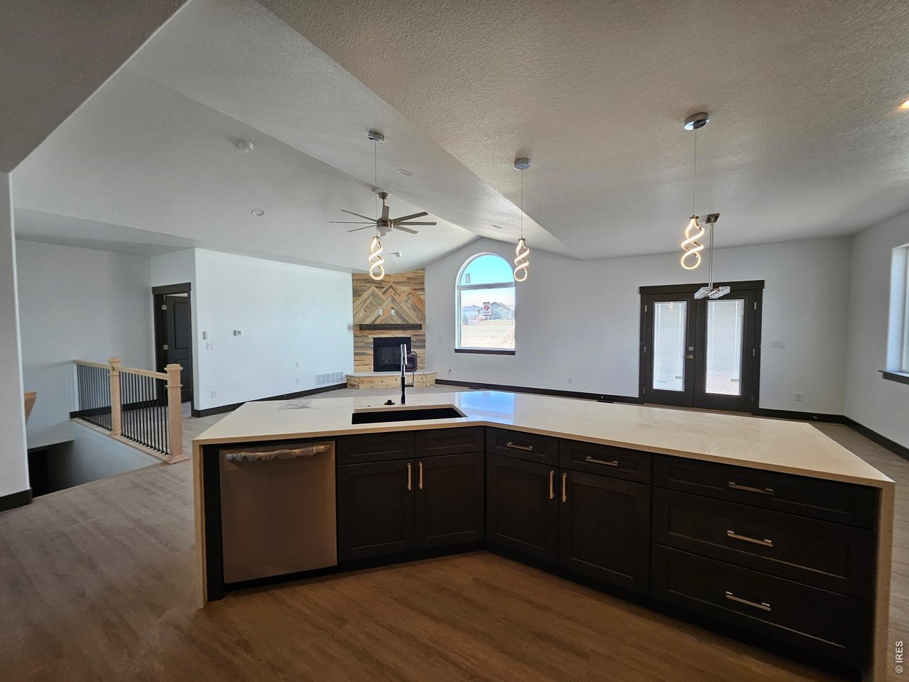 16505 Fairbanks Road North Platteville, CO 80651 - Photo 4 of 13 a kitchen with stainless steel appliances granite countertop a sink cabinets and wooden floor