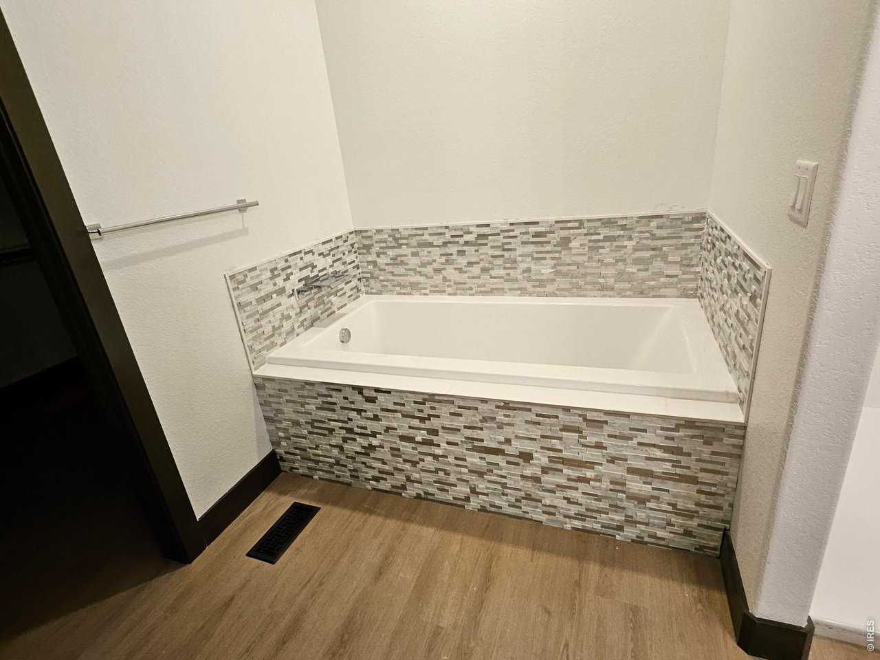 16505 Fairbanks Road North Platteville, CO 80651 - Photo 6 of 13 a bathroom with a bathtub