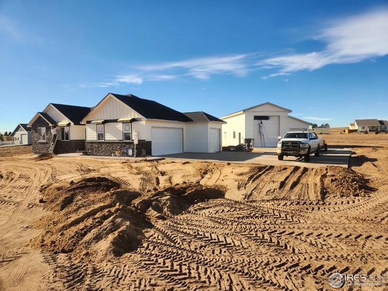 16505 Fairbanks Road North Platteville, CO 80651 - Photo 10 of 13 a front view of a house with a yard