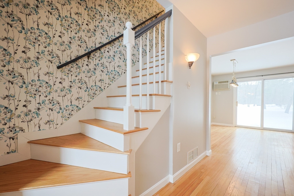 75 Sandy Pond Road, Unit 24 Ayer, MA 01432 - Photo 13 of 41 a view of entryway with wooden floor