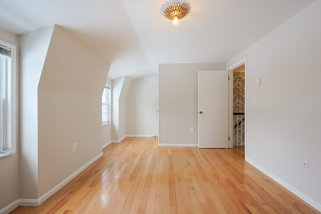 75 Sandy Pond Road, Unit 24 Ayer, MA 01432 - Photo 20 of 41 a view of empty room with wooden floor