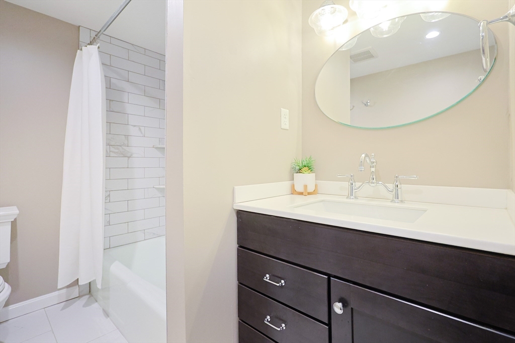 75 Sandy Pond Road, Unit 24 Ayer, MA 01432 - Photo 21 of 41 a bathroom with a sink and a mirror