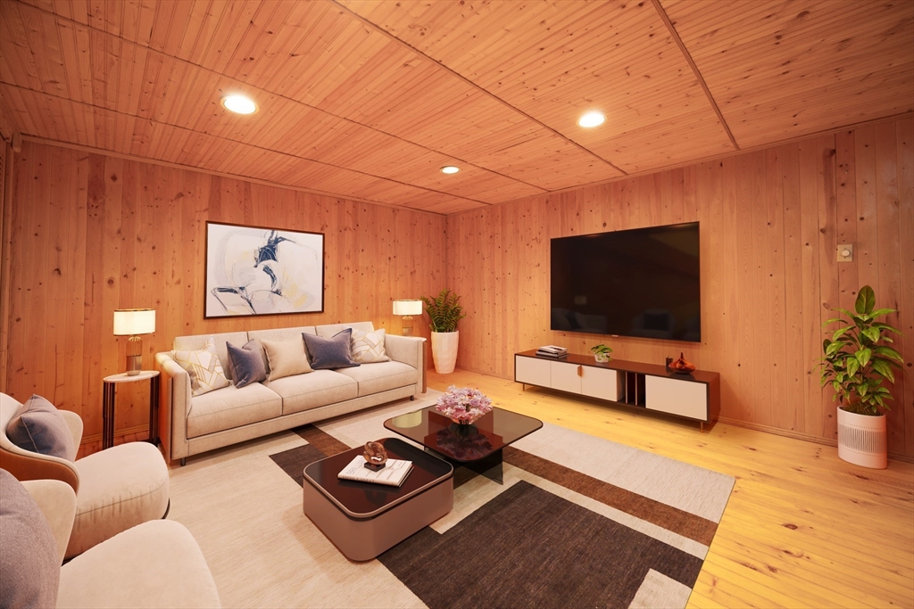 75 Sandy Pond Road, Unit 24 Ayer, MA 01432 - Photo 25 of 41 a living room with furniture and a flat screen tv