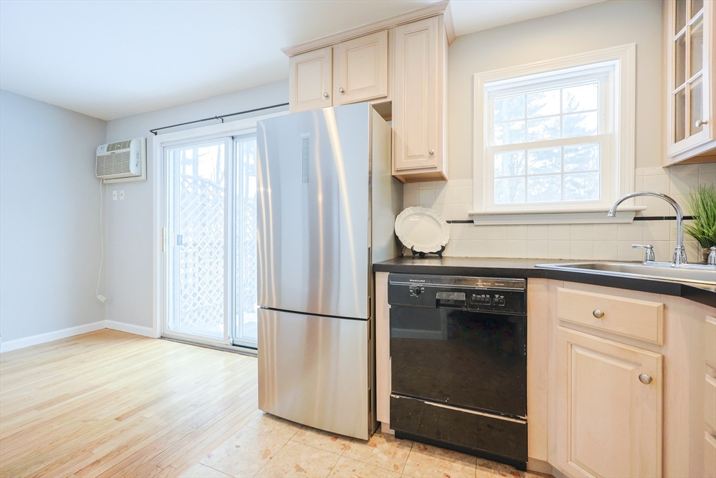 75 Sandy Pond Road, Unit 24 Ayer, MA 01432 - Photo 3 of 41 a kitchen with a refrigerator and a sink
