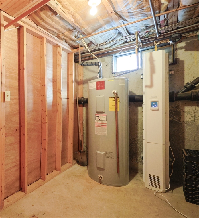 75 Sandy Pond Road, Unit 24 Ayer, MA 01432 - Photo 31 of 41 a view of a storage & utility room with refrigerator