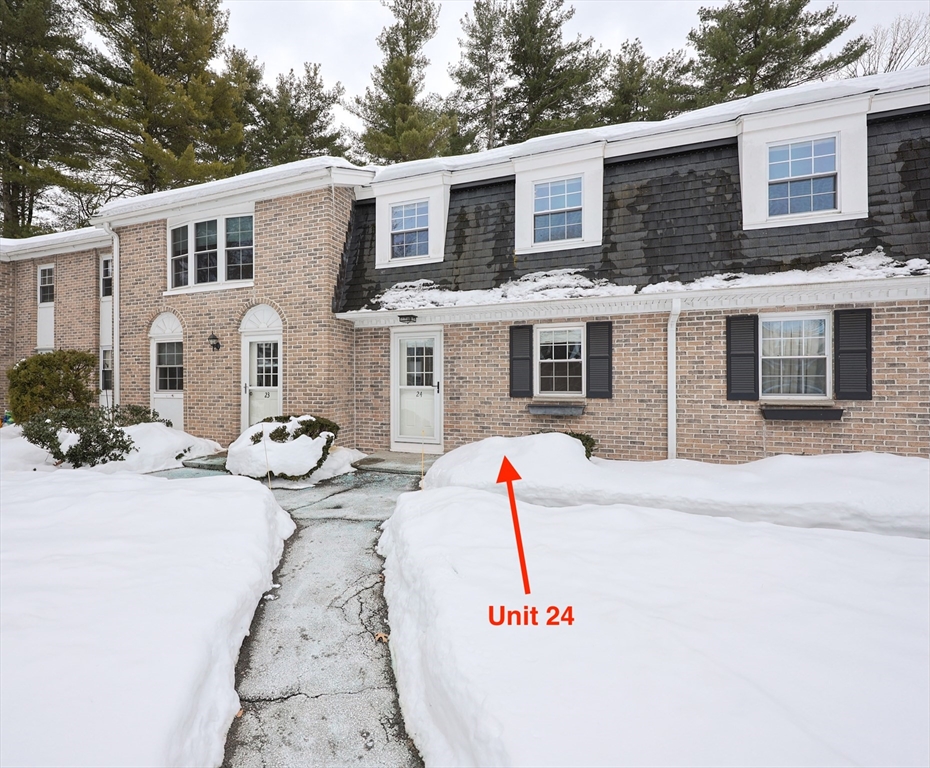 75 Sandy Pond Road, Unit 24 Ayer, MA 01432 - Photo 33 of 41 a front view of a house with a yard