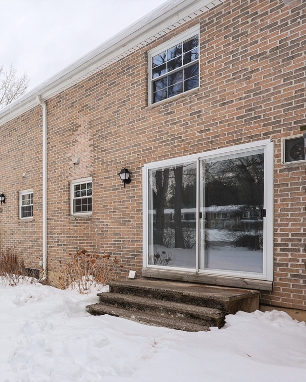 75 Sandy Pond Road, Unit 24 Ayer, MA 01432 - Photo 35 of 41 a brick building with a outdoor space