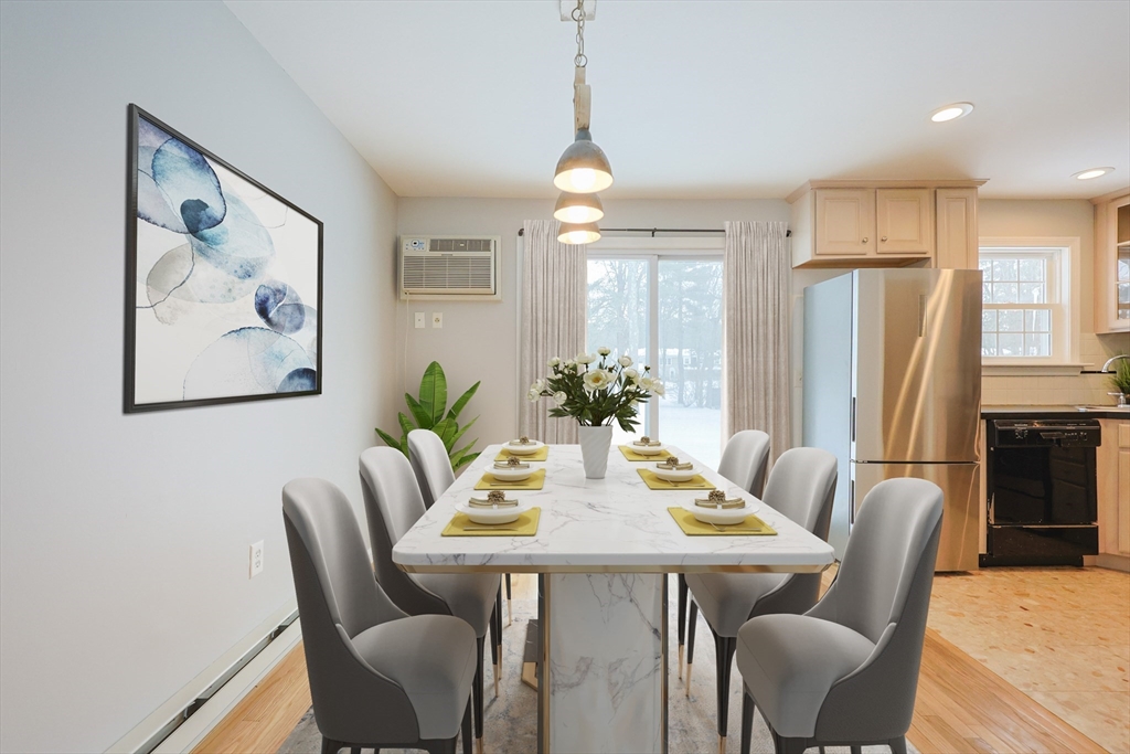 75 Sandy Pond Road, Unit 24 Ayer, MA 01432 - Photo 4 of 41 a view of a dining room with furniture window and wooden floor