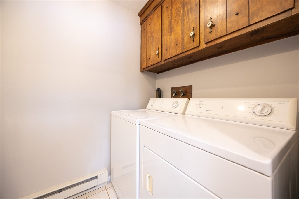 75 Sandy Pond Road, Unit 24 Ayer, MA 01432 - Photo 9 of 41 a utility room with dryer and washer