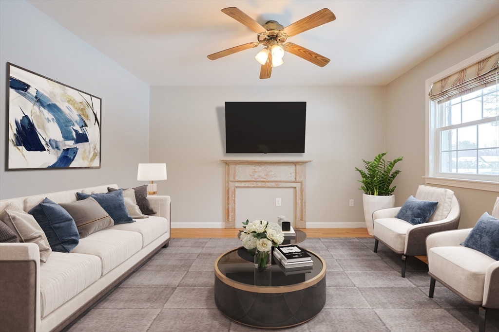 75 Sandy Pond Road, Unit 24 Ayer, MA 01432 - Photo 10 of 41 a living room with furniture a fireplace and a flat screen tv