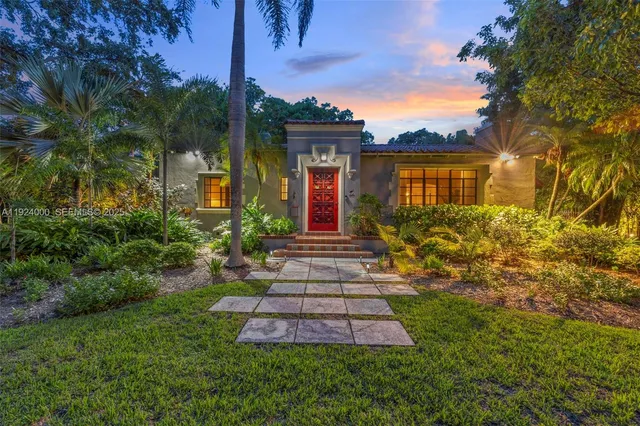 a front view of a house with garden