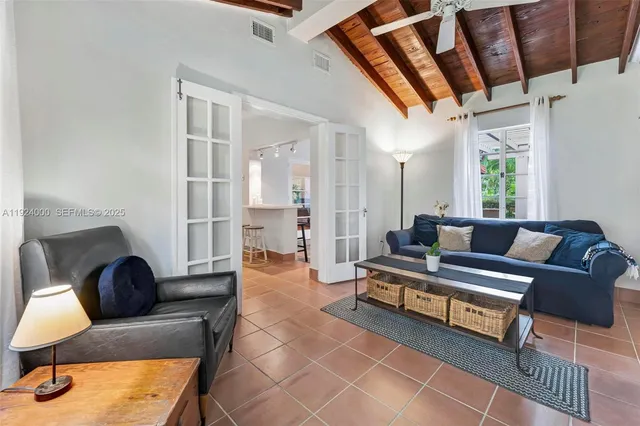 a kitchen with stainless steel appliances a refrigerator and a stove top oven