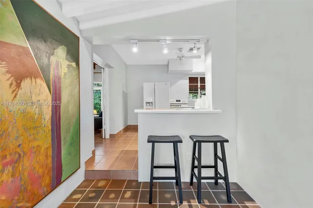 a kitchen with a sink cabinets and window