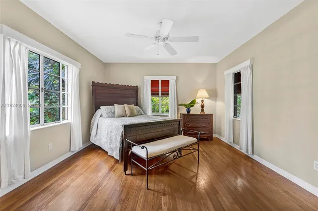 a white toilet sitting next to a bathroom sink and tub