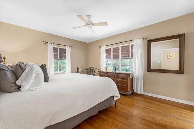 a bed room with a bed and a chandelier