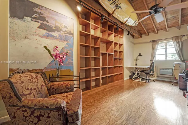 a view of a house with backyard sitting area and garden