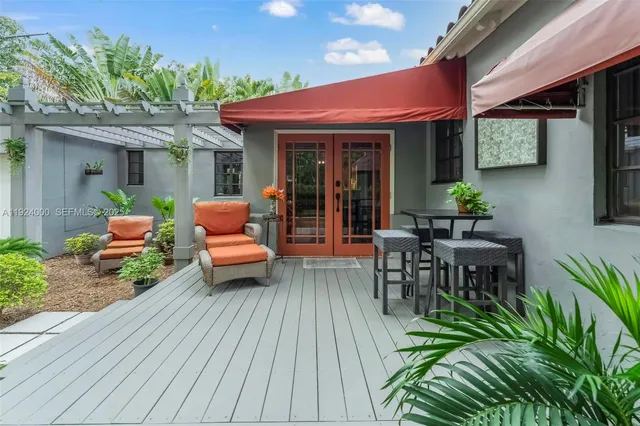 a view of a chairs and tables in a patio