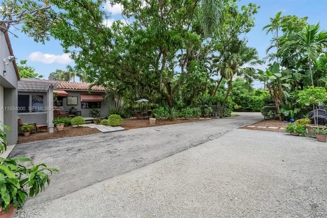 an aerial view of house with yard