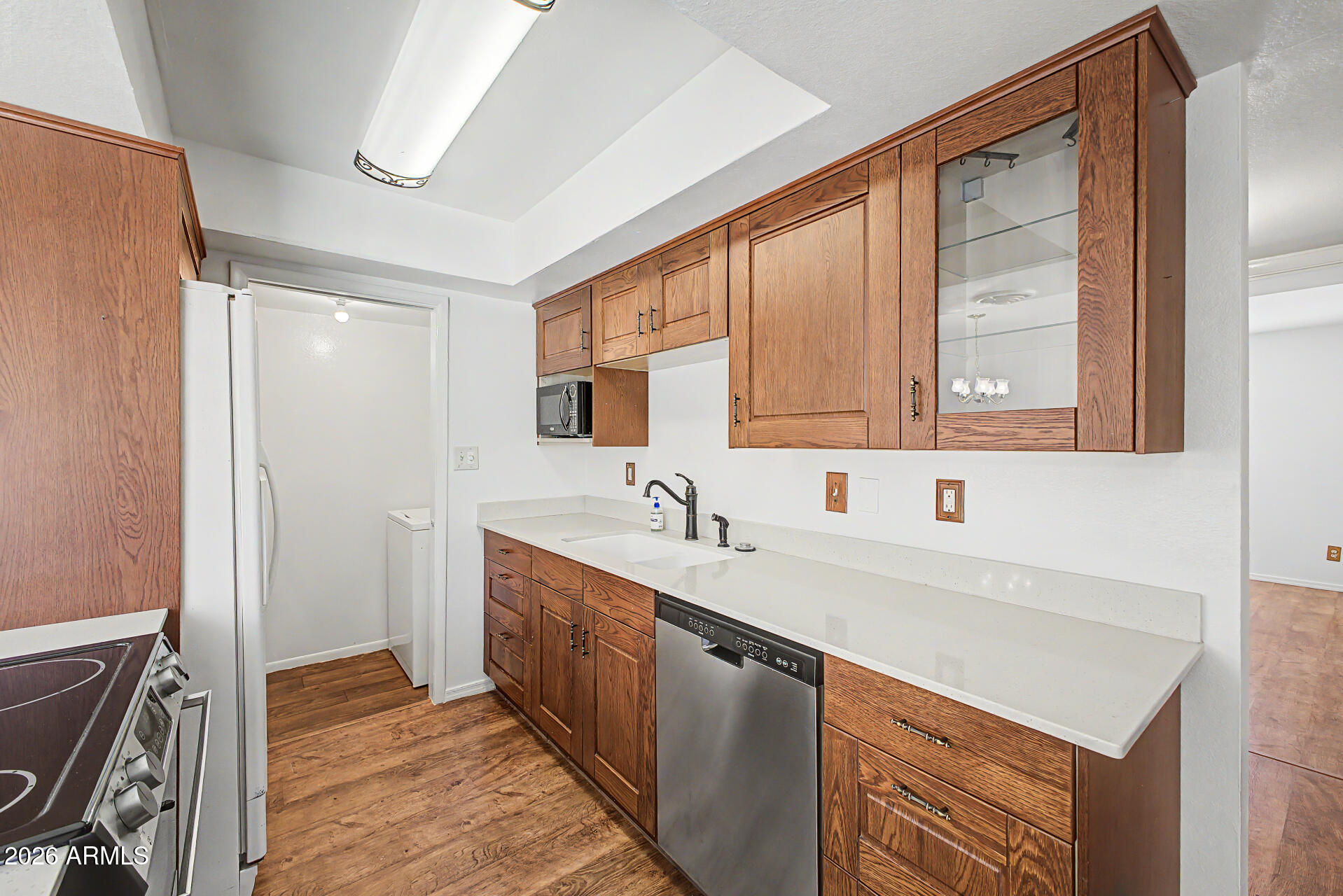 5873 East Thomas Road Scottsdale, AZ 85251 - Photo 9 of 30 a kitchen with a sink and a window