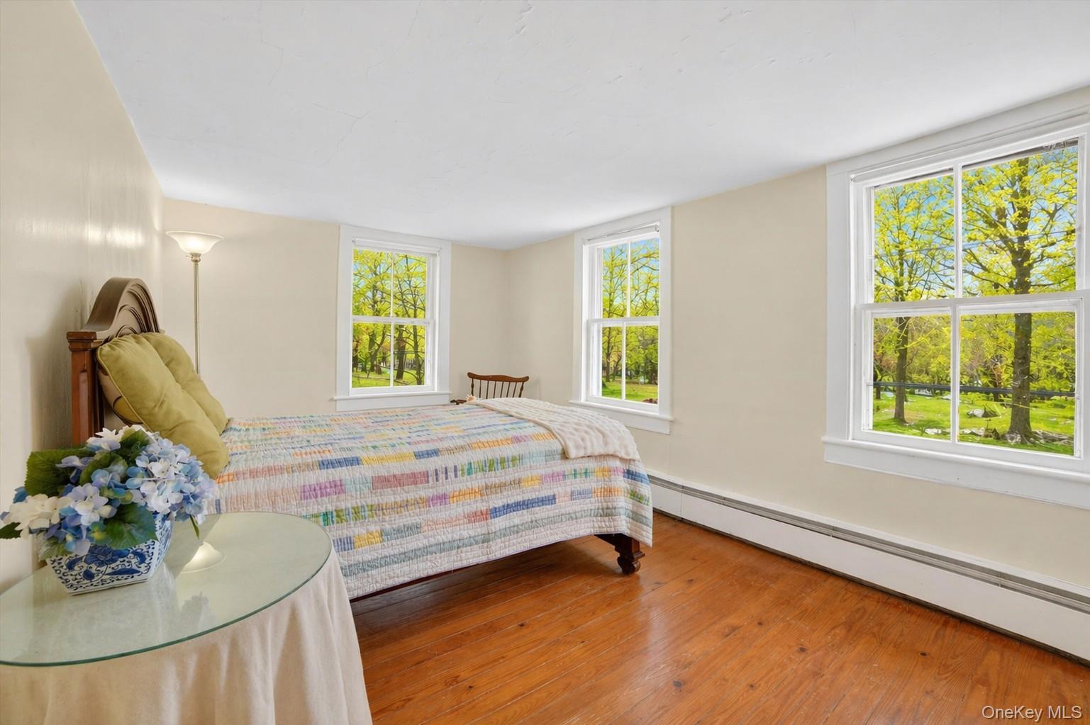 1835 Jacob Road Cortlandt Manor, NY 10567 - Photo 17 of 27 a bedroom with a bed and a window