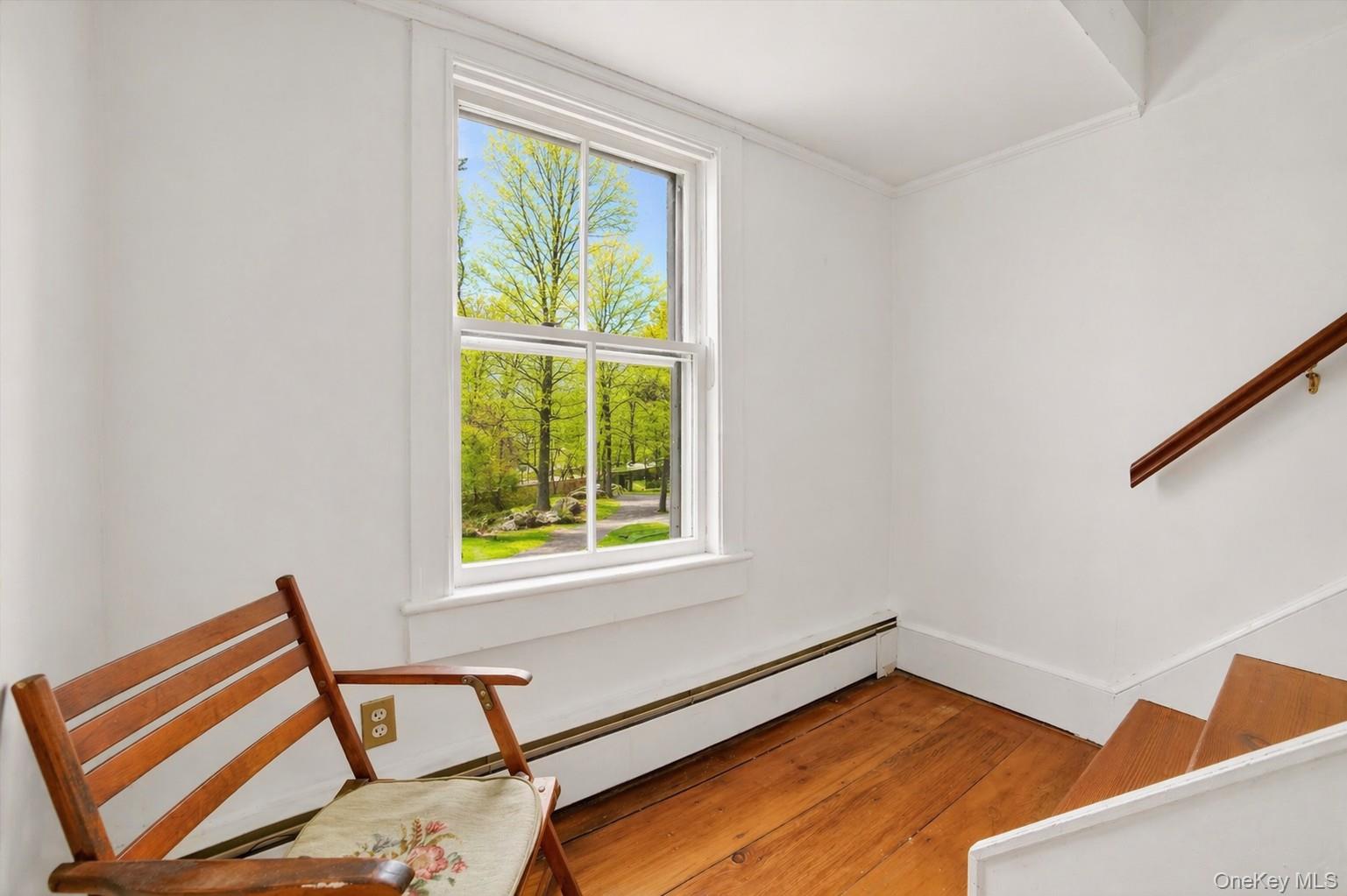 1835 Jacob Road Cortlandt Manor, NY 10567 - Photo 18 of 27 a view of a room with windows and wooden floor
