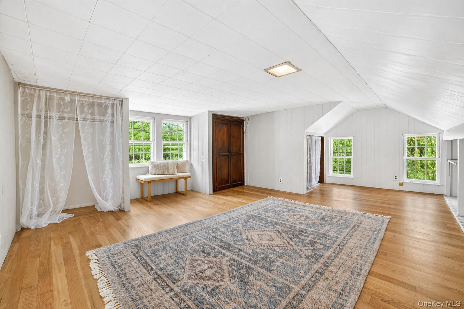 1835 Jacob Road Cortlandt Manor, NY 10567 - Photo 19 of 27 a view of a bedroom with a bed and wooden floor