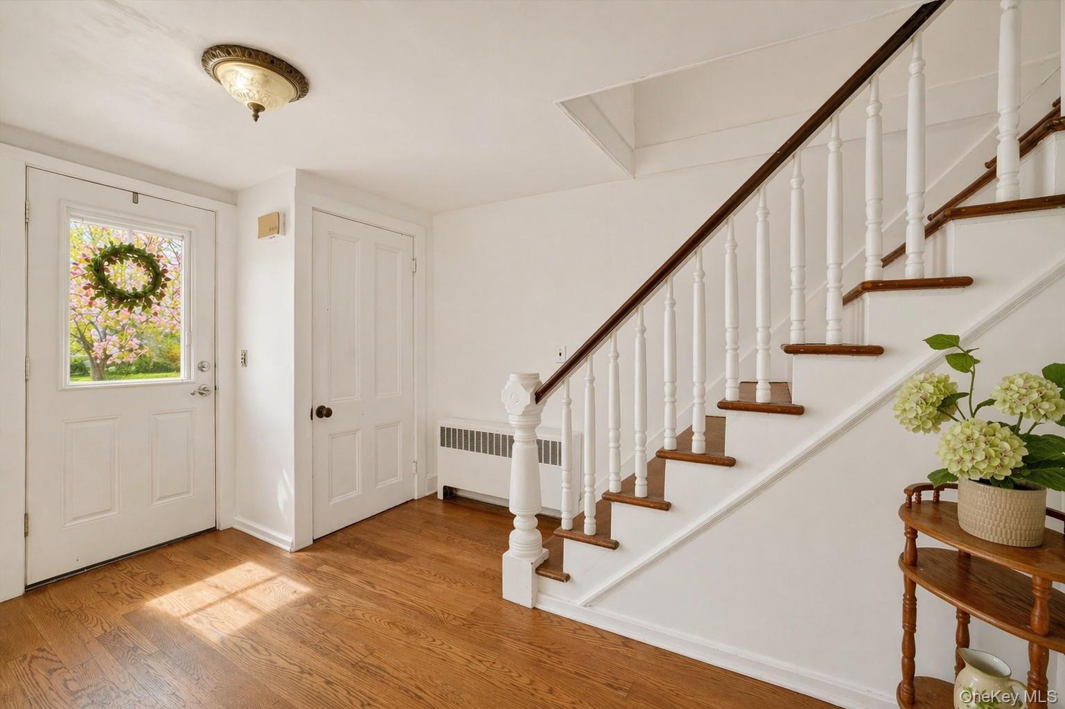 1835 Jacob Road Cortlandt Manor, NY 10567 - Photo 2 of 27 a view of entryway with wooden floor and stairs