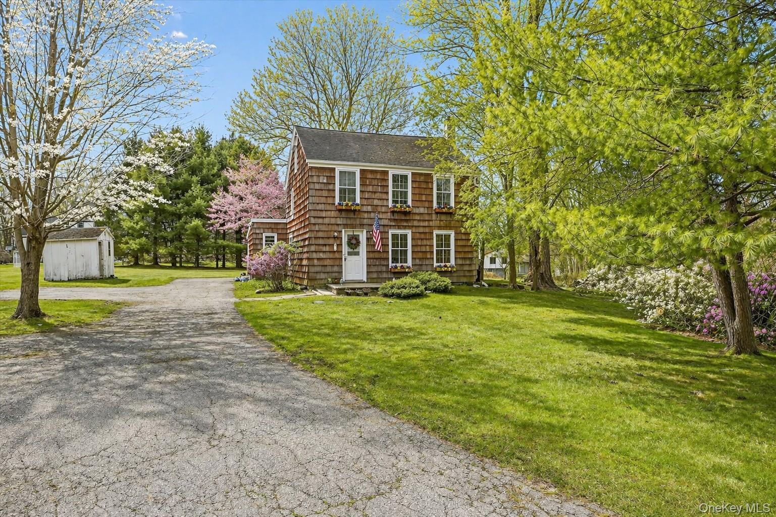 1835 Jacob Road Cortlandt Manor, NY 10567 - Photo 27 of 27 a front view of a house with a yard