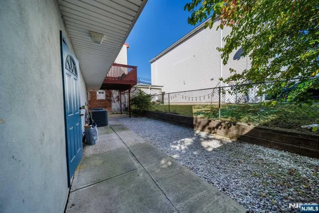 a view of house with backyard porch and outdoor seating