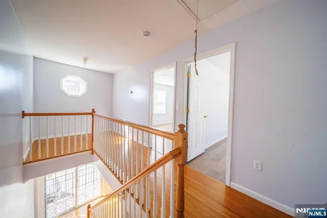 a view of an entryway with wooden floor