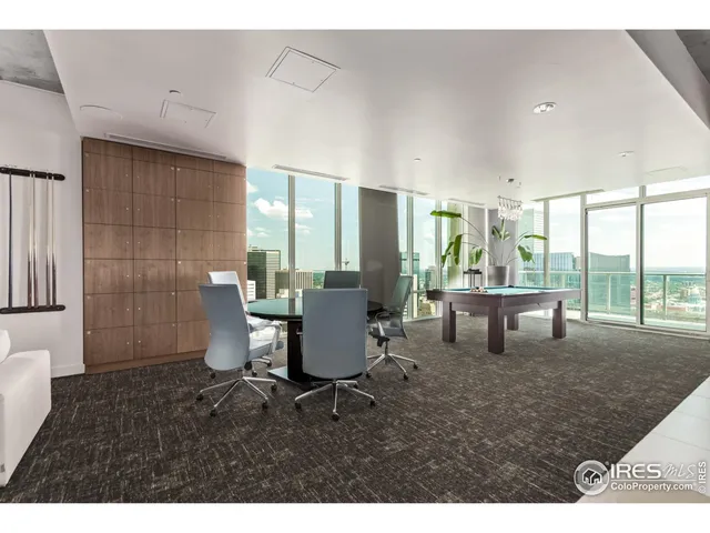 a living room with furniture a window and a table