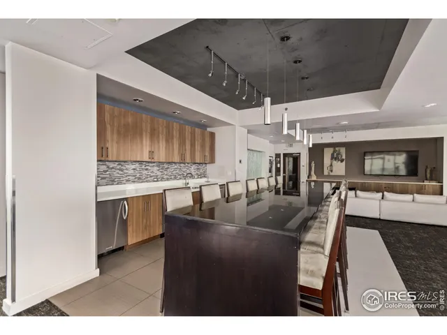 a living room with stainless steel appliances kitchen island granite countertop furniture and a kitchen view