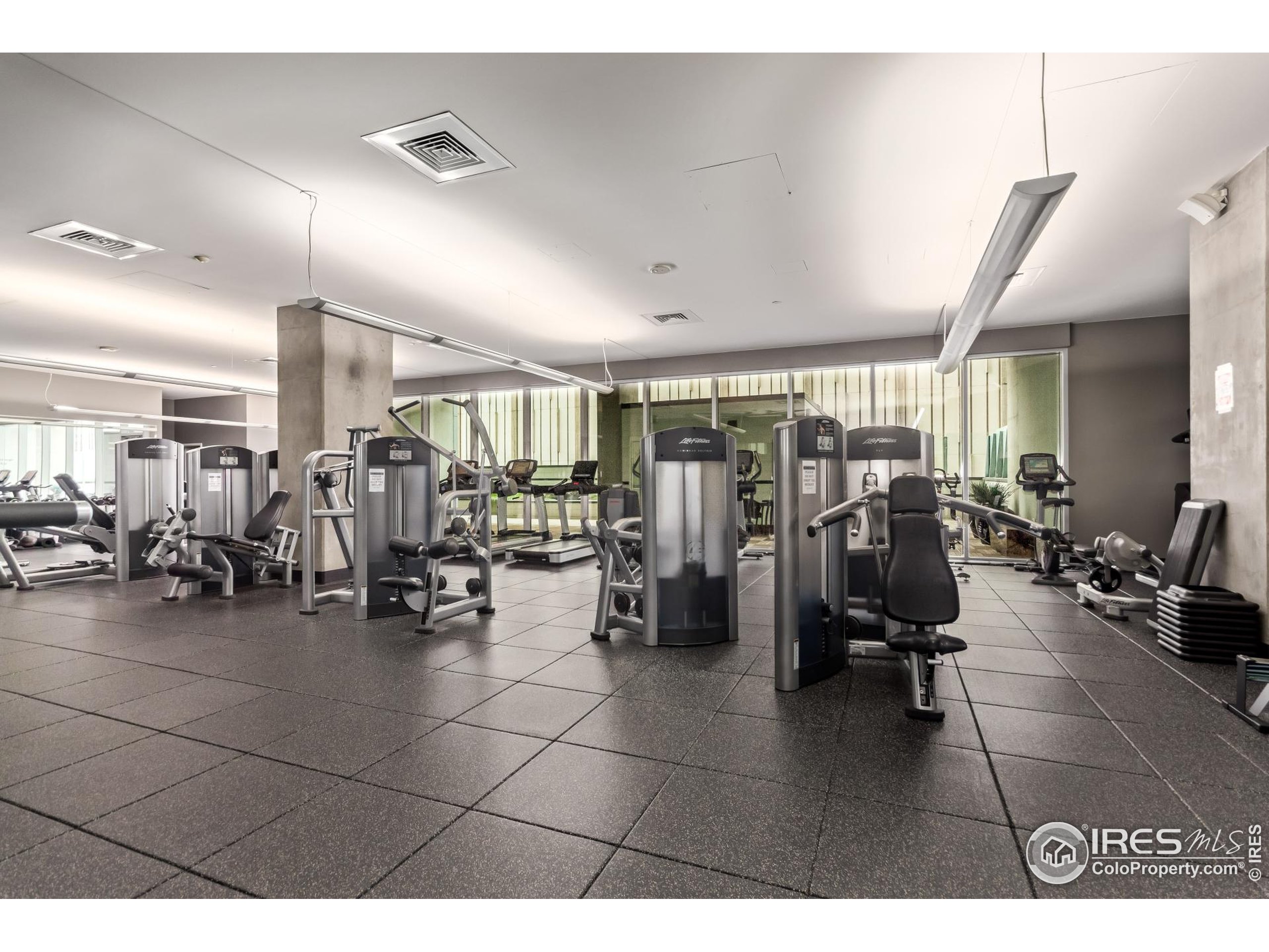 891 14th Street, Unit 3904 Denver, CO 80202 - Photo 35 of 39 a living room with lots of gym equipment and a view of living room