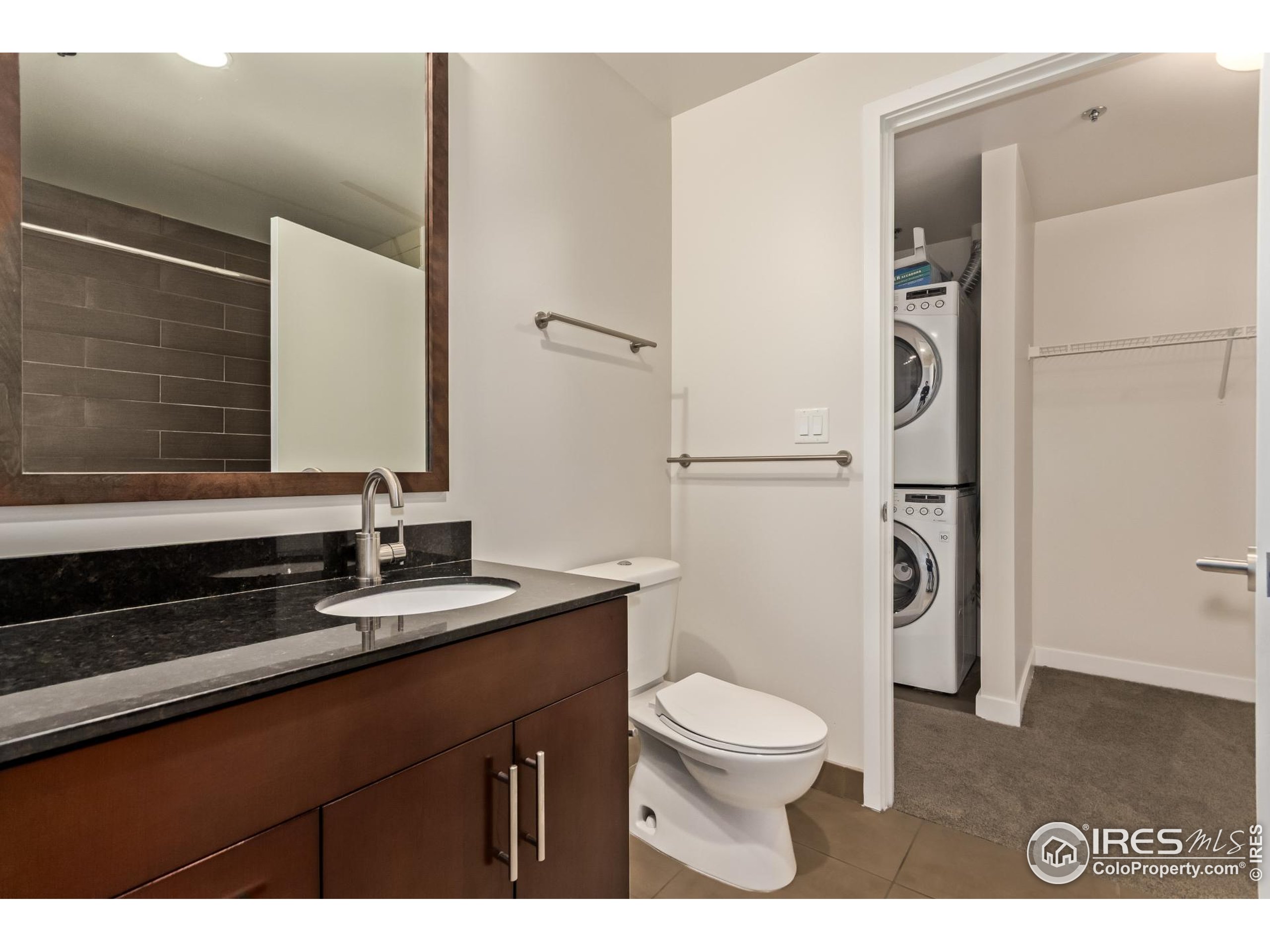 891 14th Street, Unit 3904 Denver, CO 80202 - Photo 7 of 39 a bathroom with a granite countertop sink toilet and shower