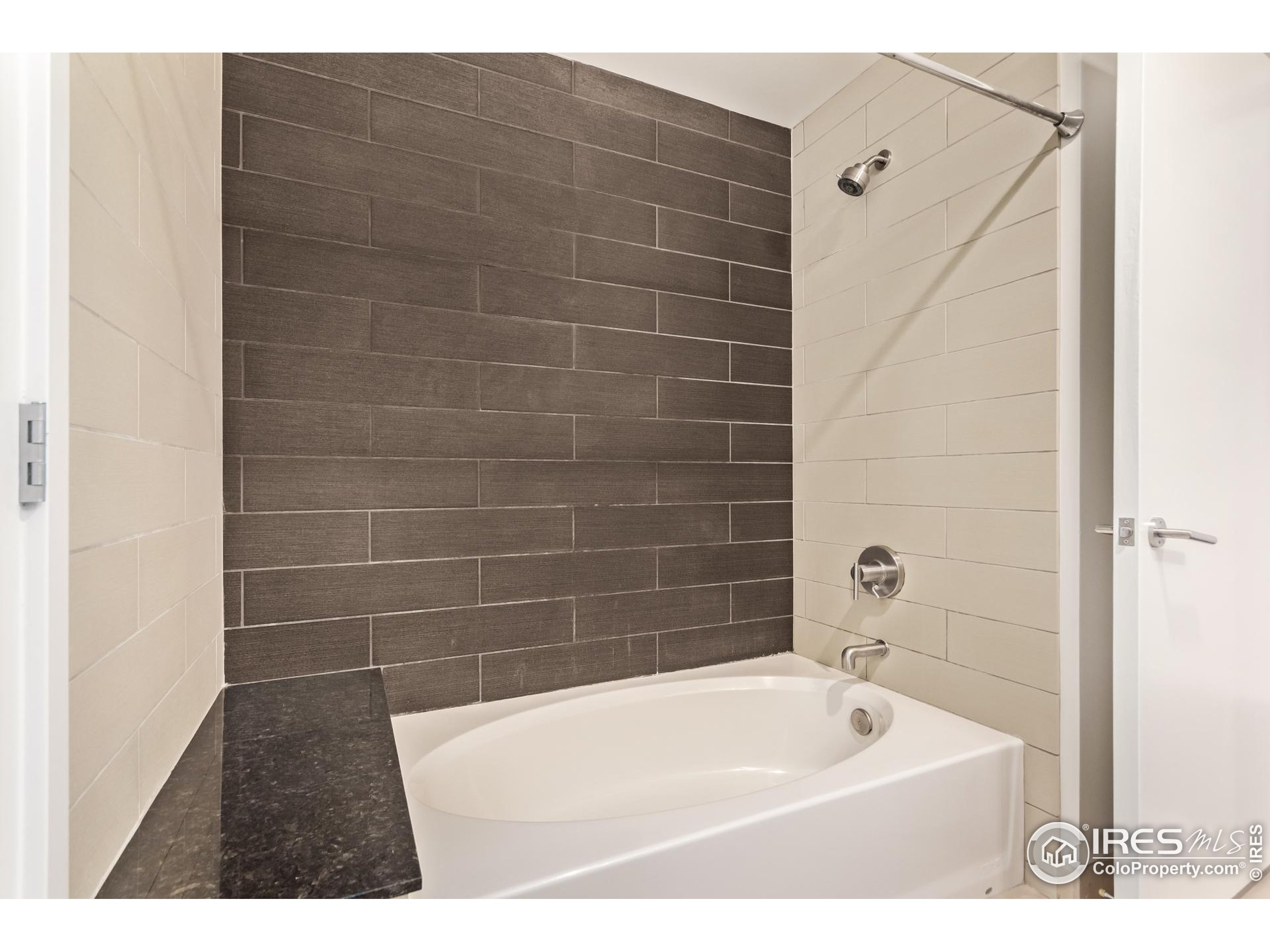 891 14th Street, Unit 3904 Denver, CO 80202 - Photo 9 of 39 a bathroom with a bathtub with a shower