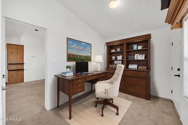 a view of a workspace with furniture