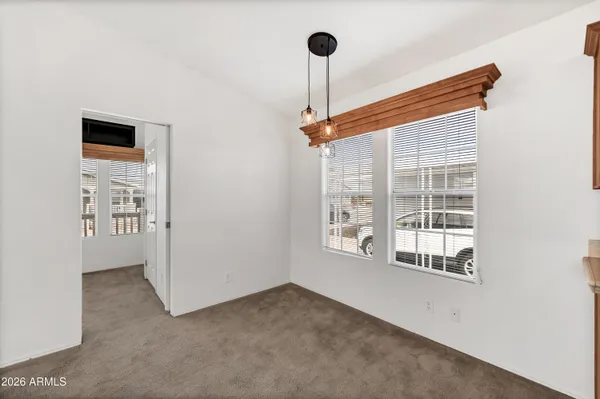 a view of empty room with windows