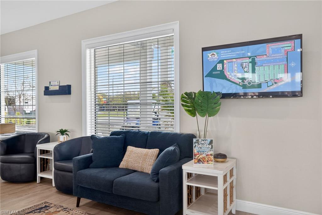 327 Sovereign Street Punta Gorda, FL 33982 - Photo 4 of 25 a living room with furniture and a large window