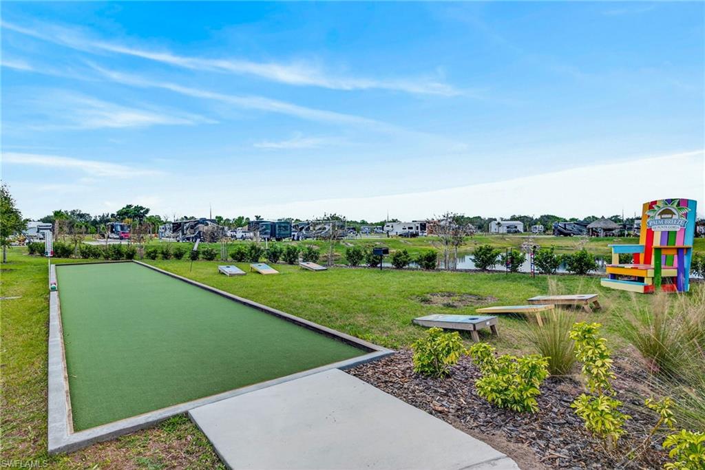 327 Sovereign Street Punta Gorda, FL 33982 - Photo 7 of 25 a view of a golf course with a lake