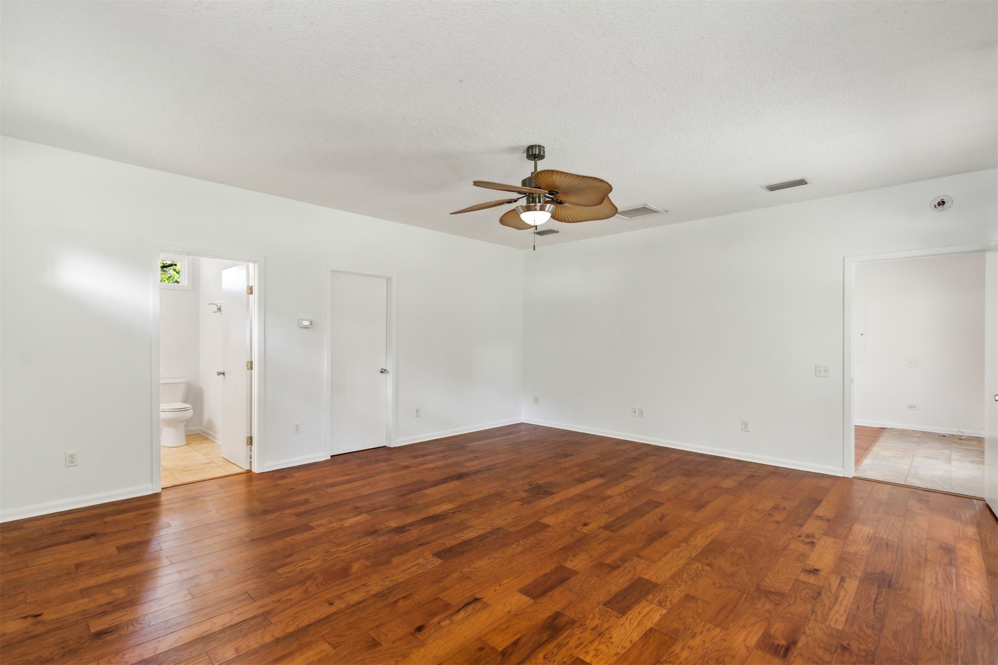 2441 Amelia Road Fernandina Beach, FL 32034 - Photo 26 of 36 a view of a livingroom with a dishwasher cabinets and wooden floor