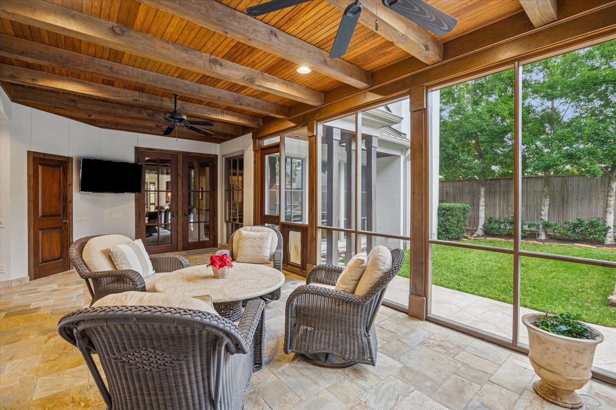 3715 Garnet Street Houston, TX 77005 - Photo 20 of 50 Off the den, this covered, screened-in patio with ceiling fans, offers views of the pool, spa and yard.
