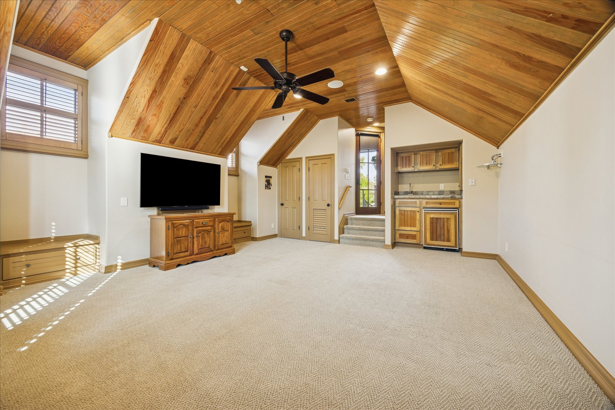 3715 Garnet Street Houston, TX 77005 - Photo 38 of 50 Another view of the game room, with full bath, kitchenette area and distinct bead board ceiling.
