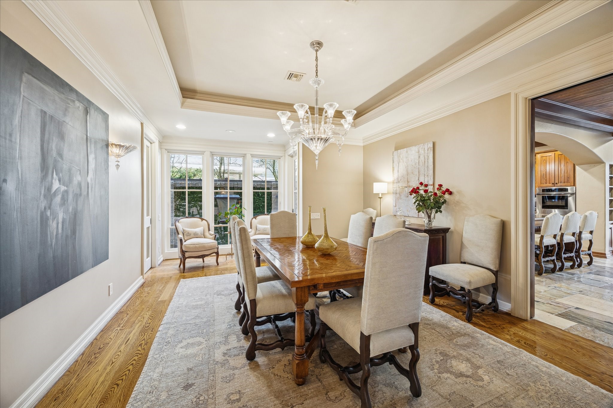 3715 Garnet Street Houston, TX 77005 - Photo 7 of 50 Large windows at the far end of the formal dining room provide plenty of light, and extend the room toward the outdoors, where a lighted fountain adds to the ambiance.