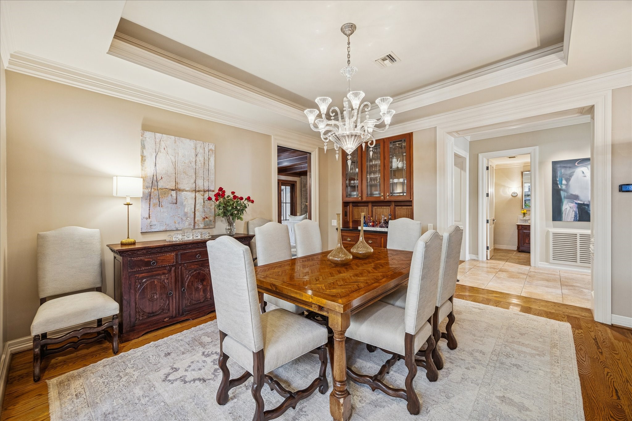3715 Garnet Street Houston, TX 77005 - Photo 8 of 50 The tray ceiling with detailed molding create a focal point overhead, reinforcing the room's formal character.