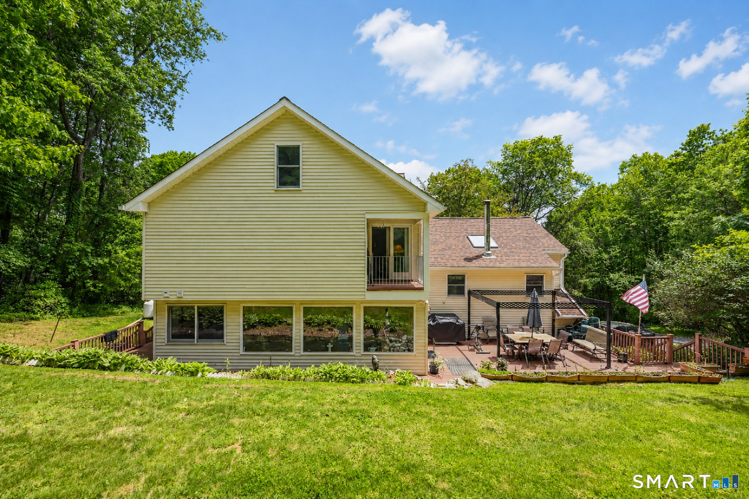155 Lake Harwinton Road Harwinton, CT 06791 - Photo 37 of 39 a view of a house with sitting area and garden