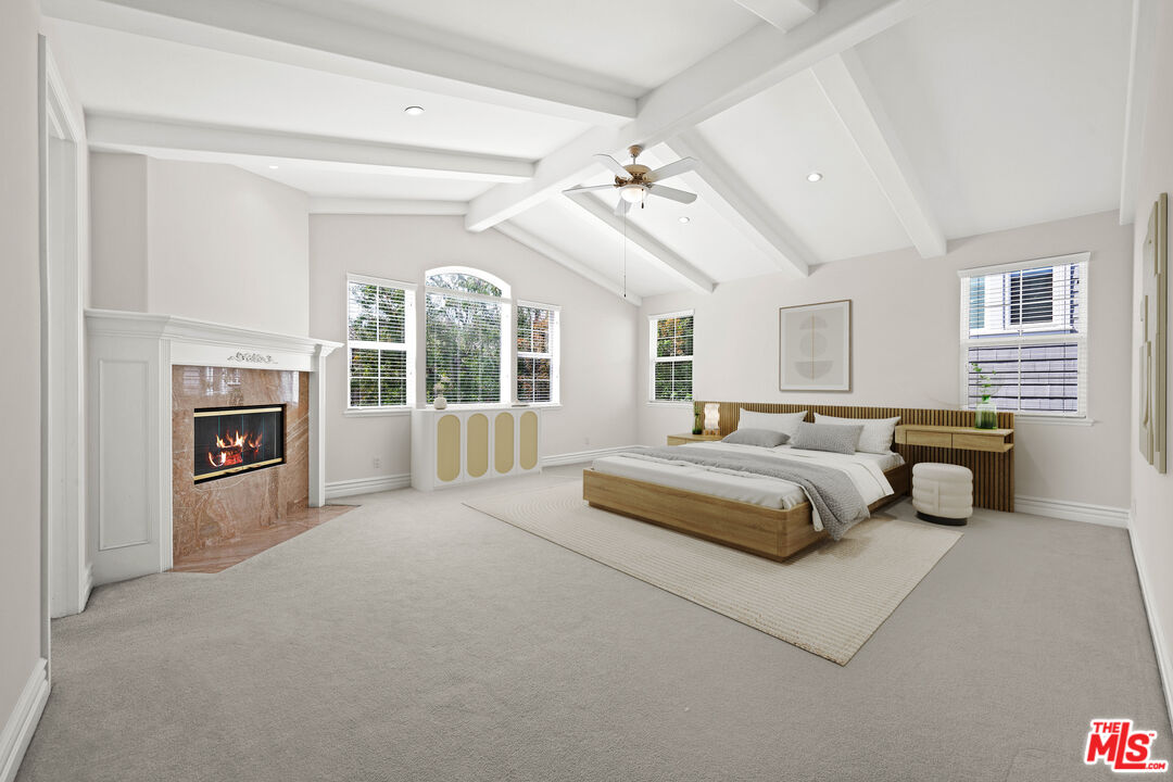 1756 Ruhland Avenue Manhattan Beach, CA 90266 - Photo 13 of 75 a spacious bedroom with a large bed and a fireplace