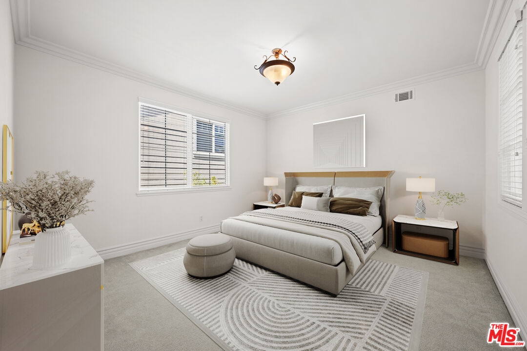 1756 Ruhland Avenue Manhattan Beach, CA 90266 - Photo 16 of 75 a bedroom with a bed and a chandelier