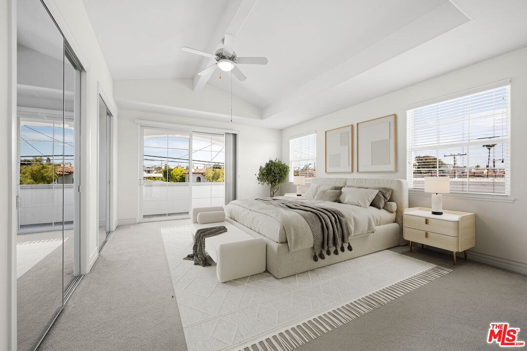 1756 Ruhland Avenue Manhattan Beach, CA 90266 - Photo 20 of 75 a spacious bedroom with a bed and a chandelier