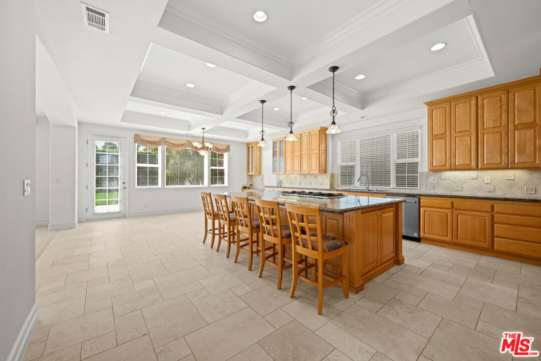 1756 Ruhland Avenue Manhattan Beach, CA 90266 - Photo 29 of 75 a large kitchen with kitchen island granite countertop a large window and stainless steel appliances